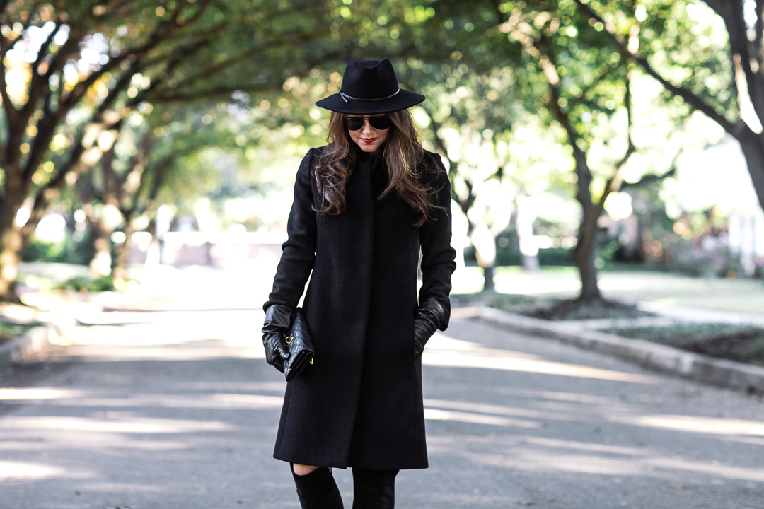Amy Havins of Dallas Wardrobe wears a black coat from Reiss.