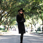 Amy Havins of Dallas Wardrobe wears a black coat from Reiss.