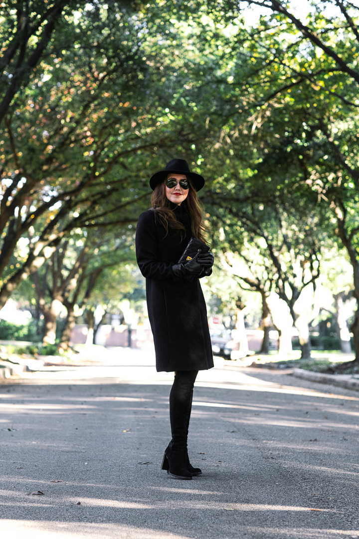 Amy Havins of Dallas Wardrobe wears a black coat from Reiss.