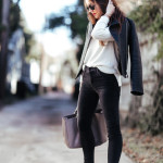 Amy Havins wears a pair of mother black high waisted jeans.