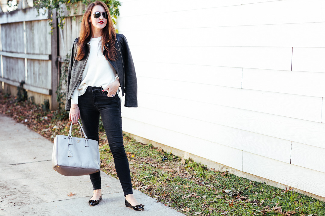 Amy Havins wears a pair of mother black high waisted jeans.