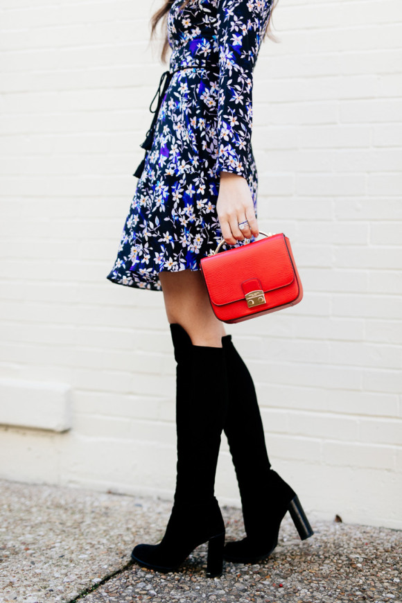 Amy Havins wears a blue floral print Shoshanna dress with Stuart Weitzman over the knee boots.