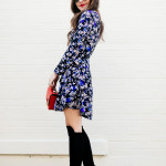 Amy Havins wears a blue floral print Shoshanna dress with Stuart Weitzman over the knee boots.