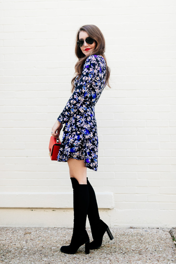 Amy Havins wears a blue floral print Shoshanna dress with Stuart Weitzman over the knee boots.