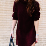 Amy Havins wears a sweater dress and over the knee boots.