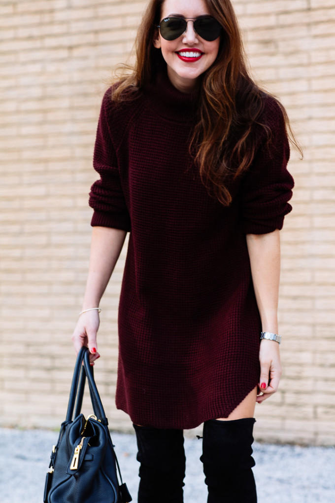 Amy Havins wears a sweater dress and over the knee boots.