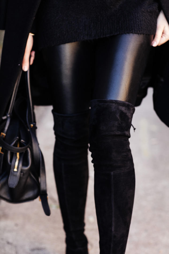 Amy Havins wears an all black look paired with faux leather leggings.