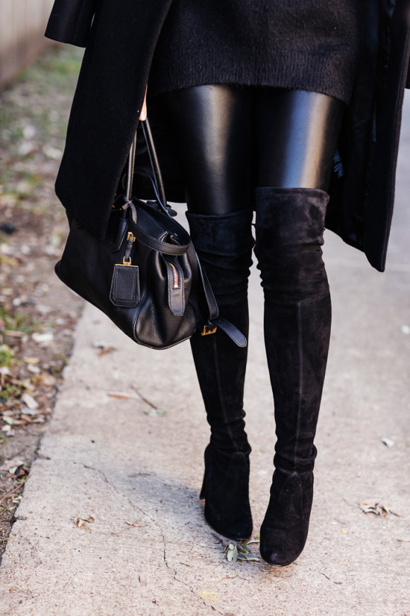 Amy Havins wears an all black look paired with faux leather leggings.