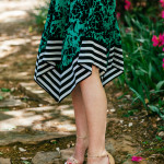 Amy Havins wears a green handkerchief dress from Shoshanna.