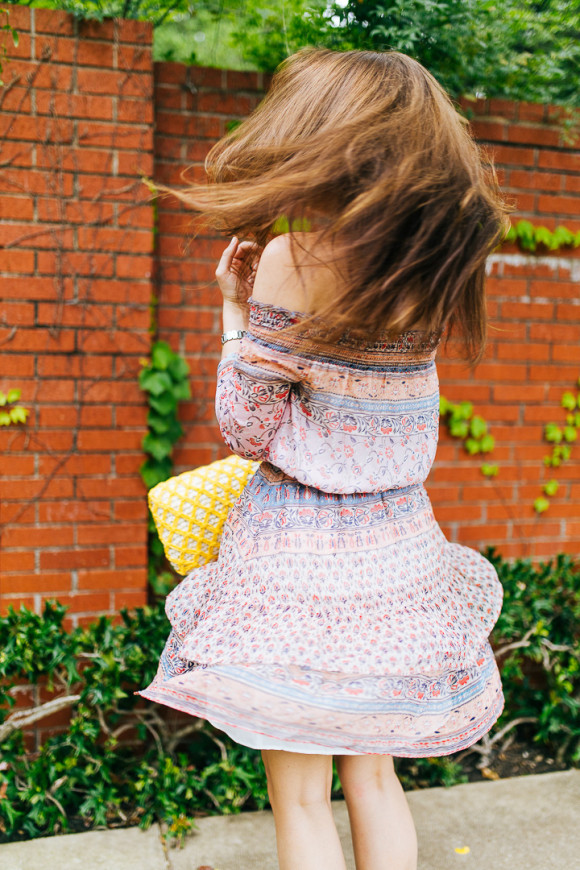 Dallas Blogger Amy Havins wears a printed off the shoulder shoshanna dress.