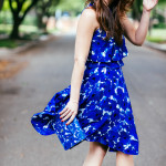 Dallas Blogger, Amy Havins, wears a blue floral print Ivanka trump a-line dress.