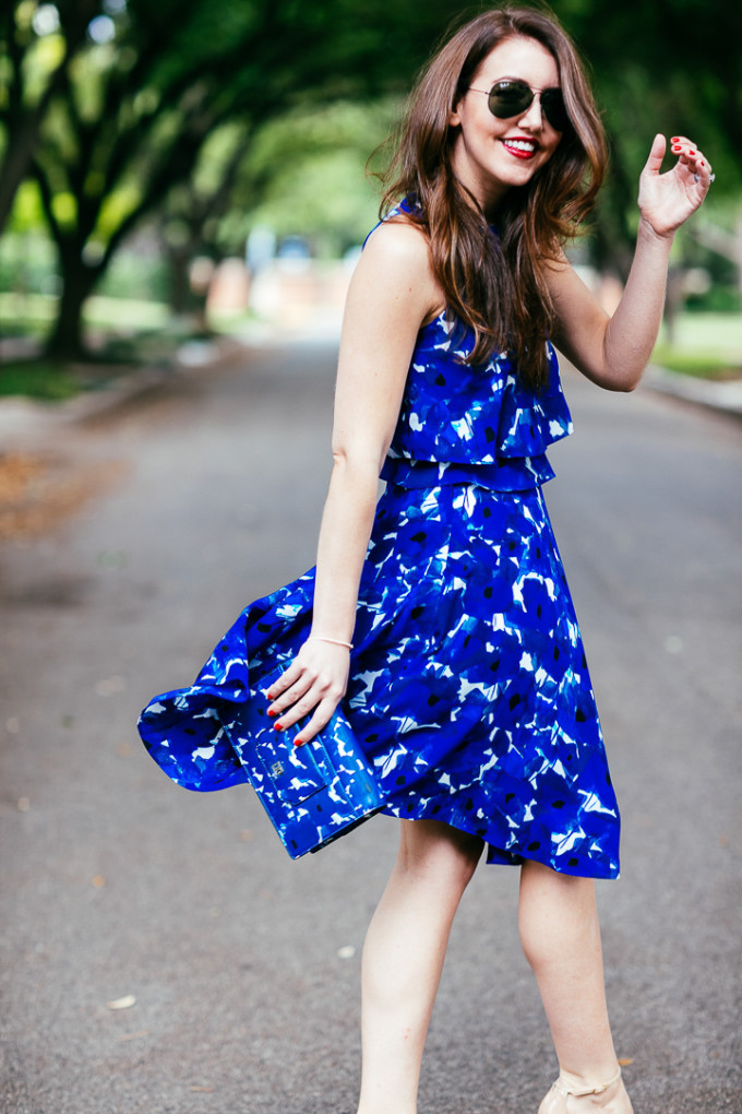 Dallas Blogger, Amy Havins, wears a blue floral print Ivanka trump a-line dress.