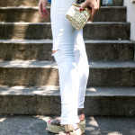 Amy Havins wears white jeans paired with a jean jacket.