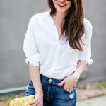 Amy Havins wears ripped 7 for all mankind jeans and a white blouse paired with ivanka trump shoes.