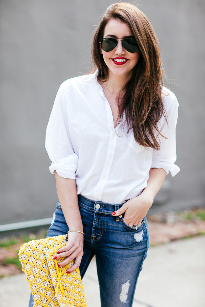 Amy Havins wears ripped 7 for all mankind jeans and a white blouse paired with ivanka trump shoes.