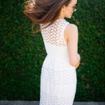 Dallas blogger, Amy Havins, wears a white shoshanna midi dress.