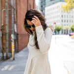 Amy Havins wears a pink peplum blouse with dark skinny jeans.