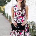 Amy Havins shares her holiday style by wearing a floral fit and flare draper james dress.