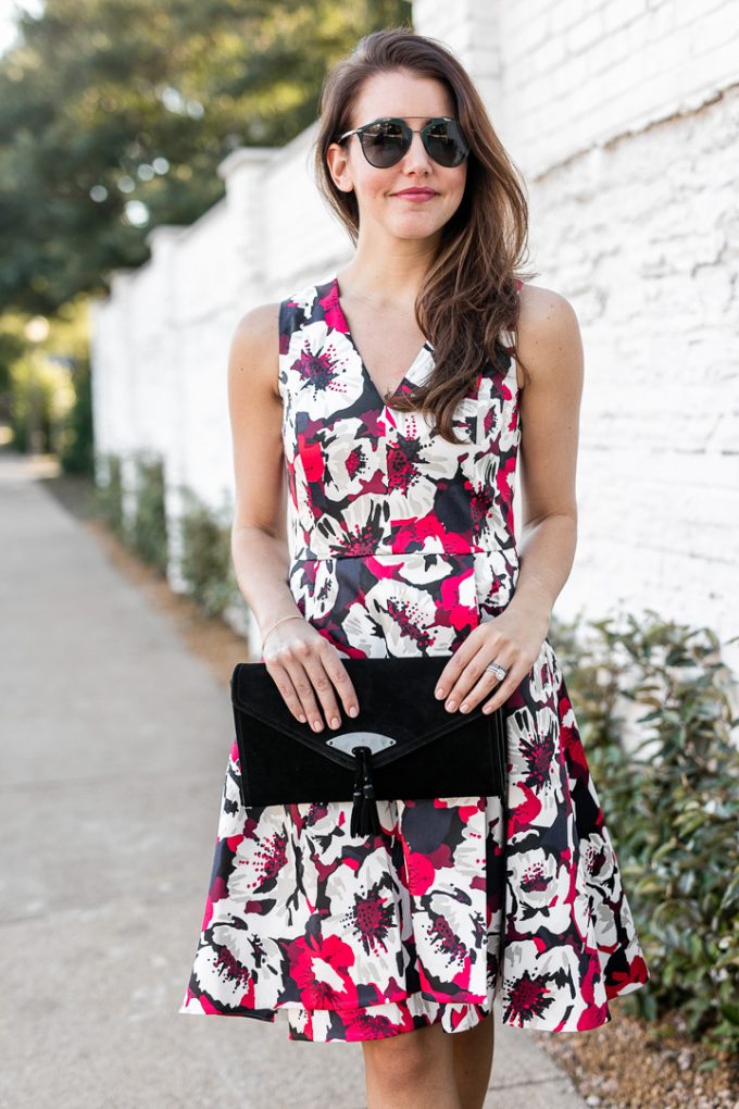 Amy Havins shares her holiday style by wearing a floral fit and flare draper james dress.