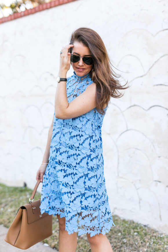 Amy Havins wears a baby blue lace dress with stuart weitzman nude heels.