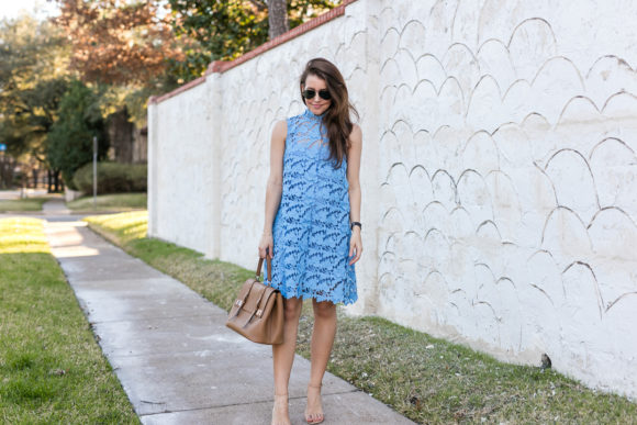 Amy Havins wears a baby blue lace dress with stuart weitzman nude heels.