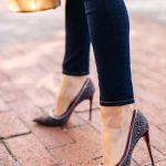 Amy Havins wears jeans and classic pumps.