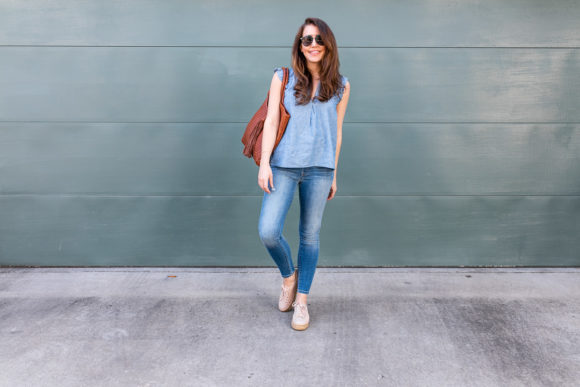 Amy Havins wears denim and a blouse from Stitch Fix.