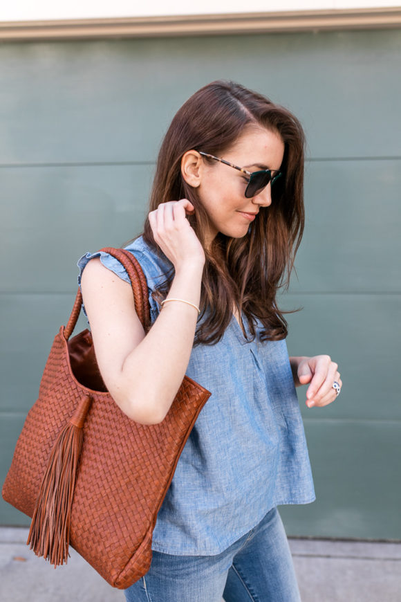 Amy Havins wears denim and a blouse from Stitch Fix.