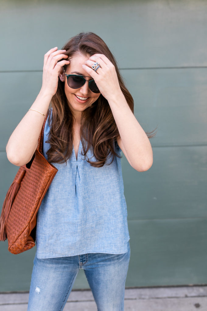 Amy Havins wears denim and a blouse from Stitch Fix.