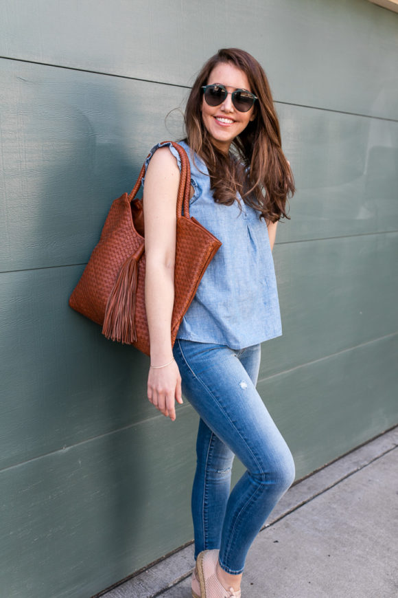 Amy Havins wears denim and a blouse from Stitch Fix.