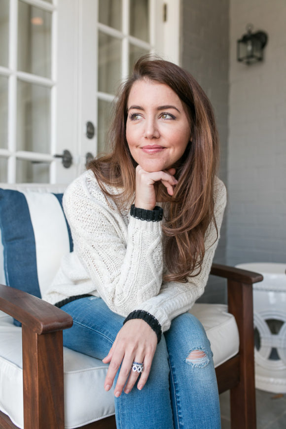 Amy Havins wears denim and a blouse from Stitch Fix.