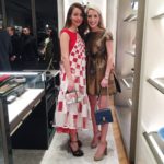 Amy Havins wears a red and white Fendi dress for the grand opening.