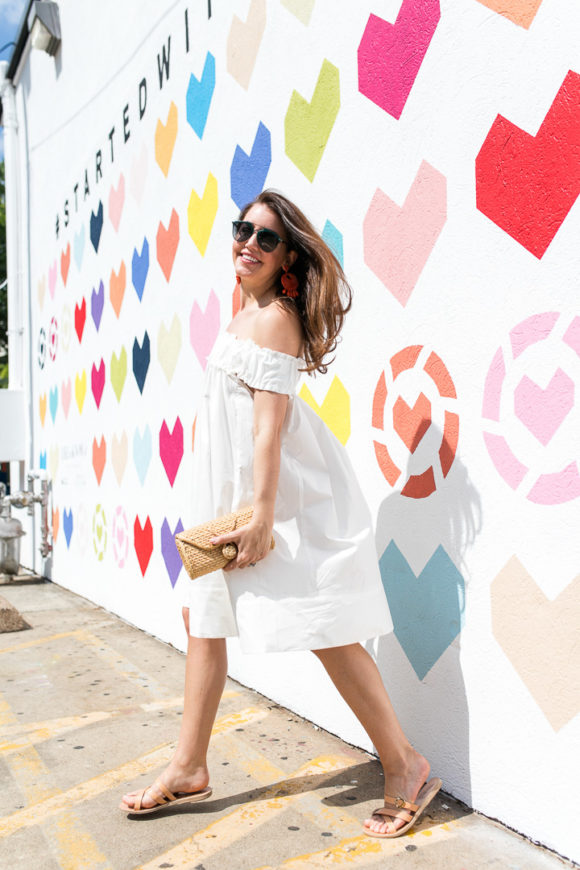 Amy Havins wears a white off the shoulder dress.