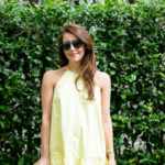 Amy Havins wears a yellow summer halter dress.