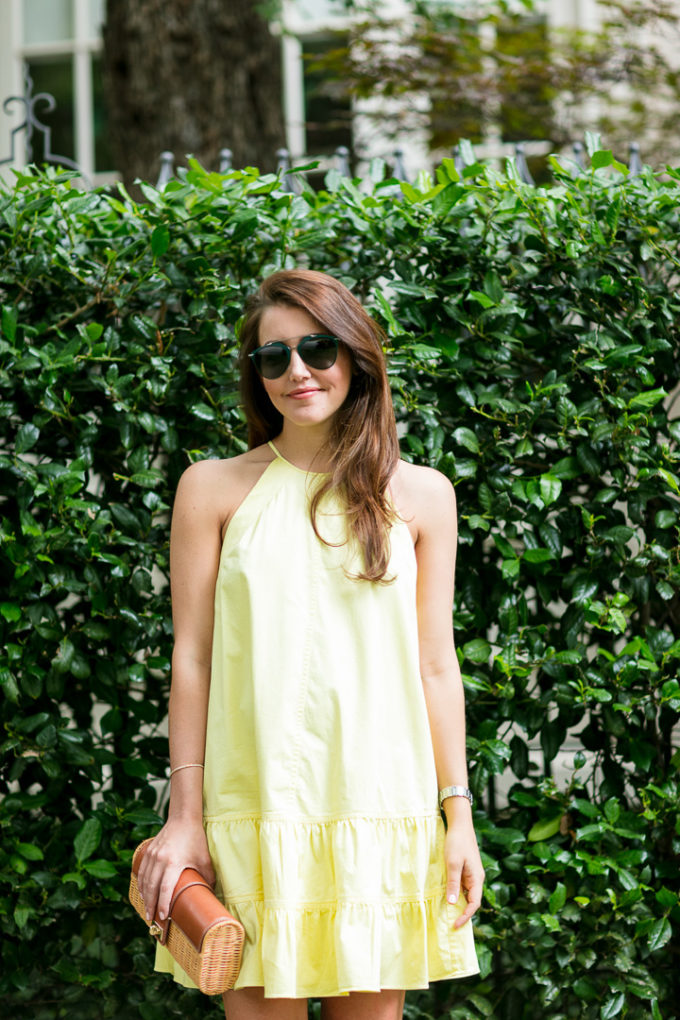 Amy Havins wears a yellow summer halter dress.