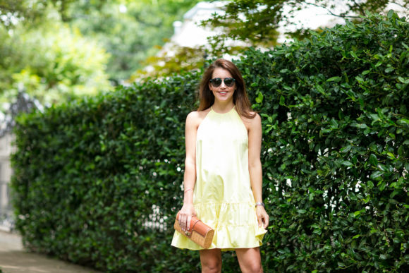 Amy Havins wears a yellow summer halter dress.