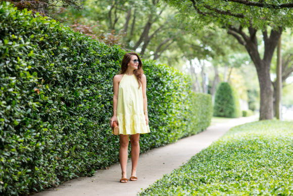 Amy Havins wears a yellow summer halter dress.