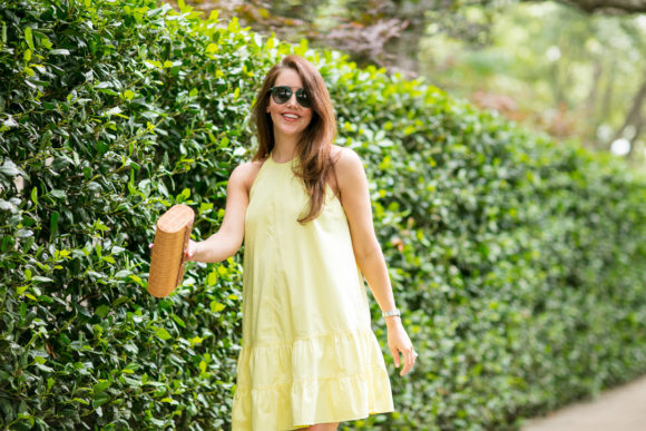 Amy Havins wears a yellow summer halter dress.