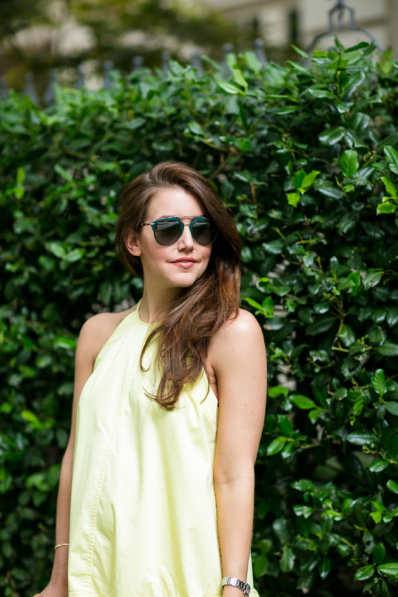 Amy Havins wears a yellow summer halter dress.