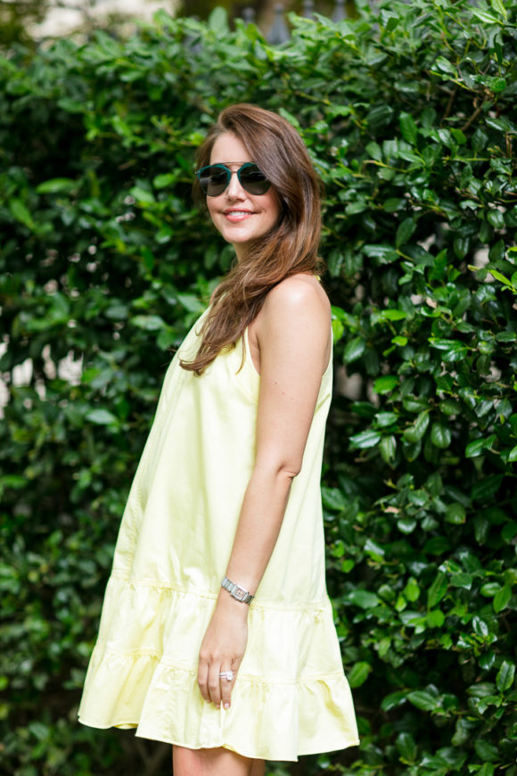 Amy Havins wears a yellow summer halter dress.