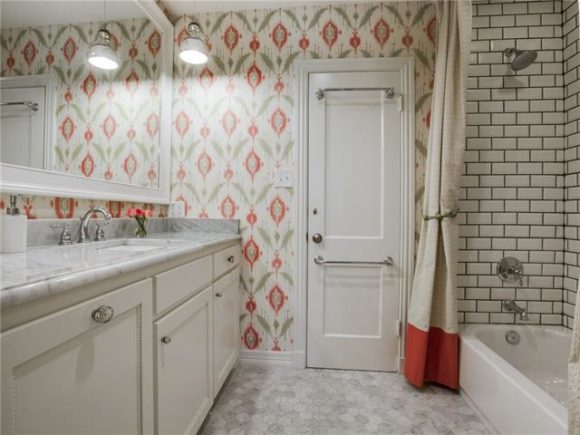 Amy Havins shares before and after photos of a bathroom they redid in their house.