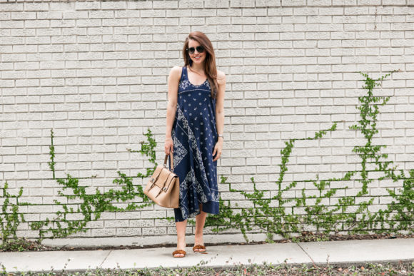 Amy Havins wears a navy shift dress with a bandana print.