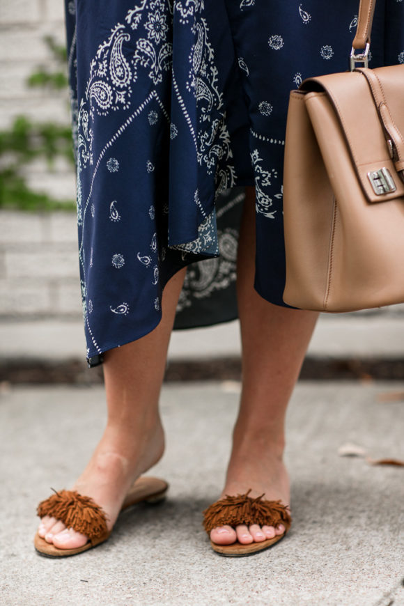 Amy Havins wears a navy shift dress with a bandana print.