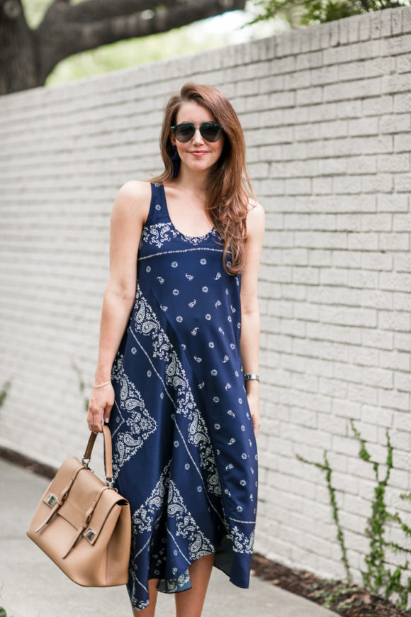 Amy Havins wears a navy shift dress with a bandana print.