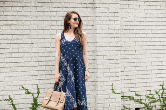 Amy Havins wears a navy shift dress with a bandana print.