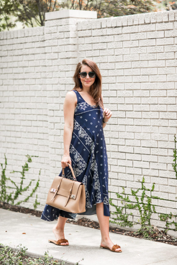 Amy Havins wears a navy shift dress with a bandana print.