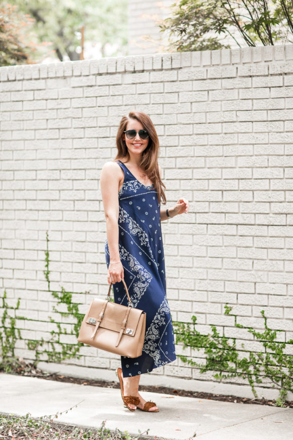 Amy Havins wears a navy shift dress with a bandana print.