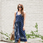 Amy Havins wears a navy shift dress with a bandana print.