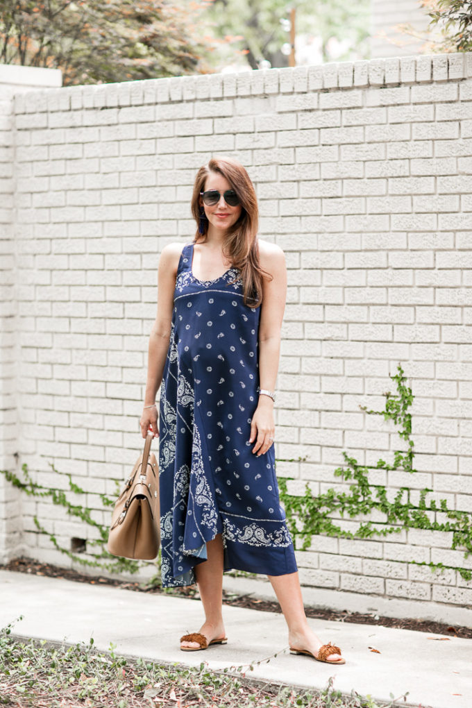 Amy Havins wears a navy shift dress with a bandana print.