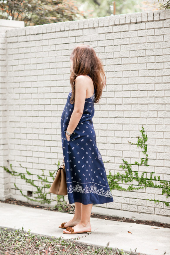 Amy Havins wears a navy shift dress with a bandana print.